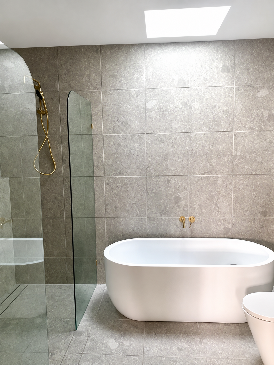 Bathroom renovation with bathtub and premium finishes.