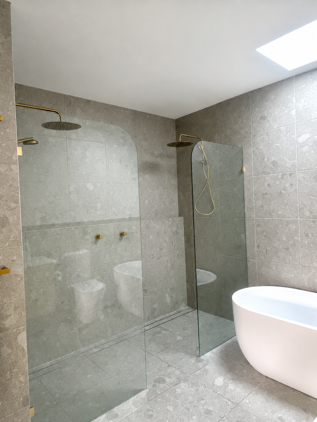 Modern bathroom renovation with vanity and shower.